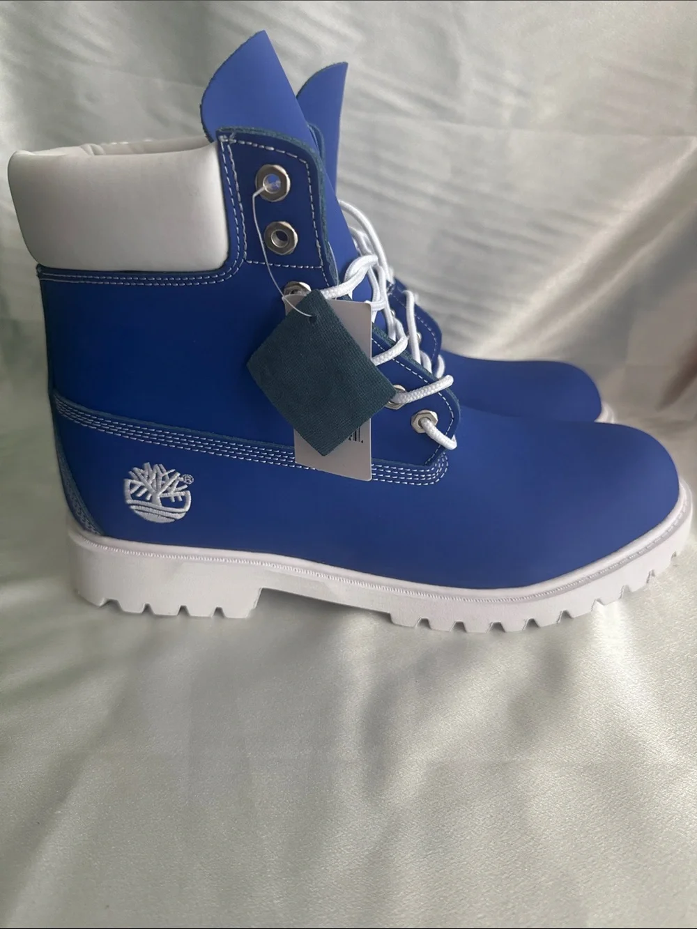 New! Timberland Premium 6-Inch boots featuring a vibrant blue nubuck upper.